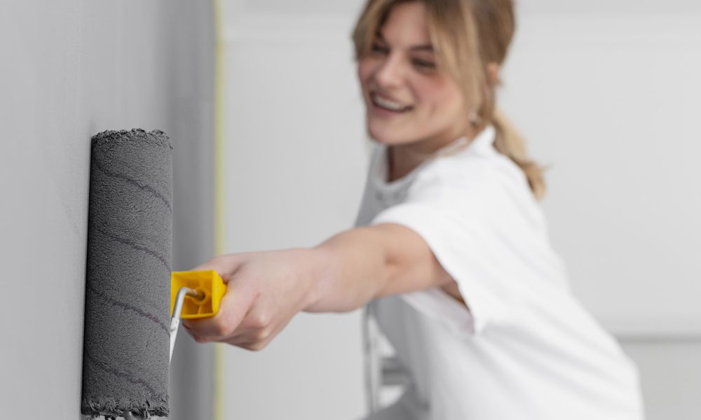 medium-shot-smiley-woman-using-roller